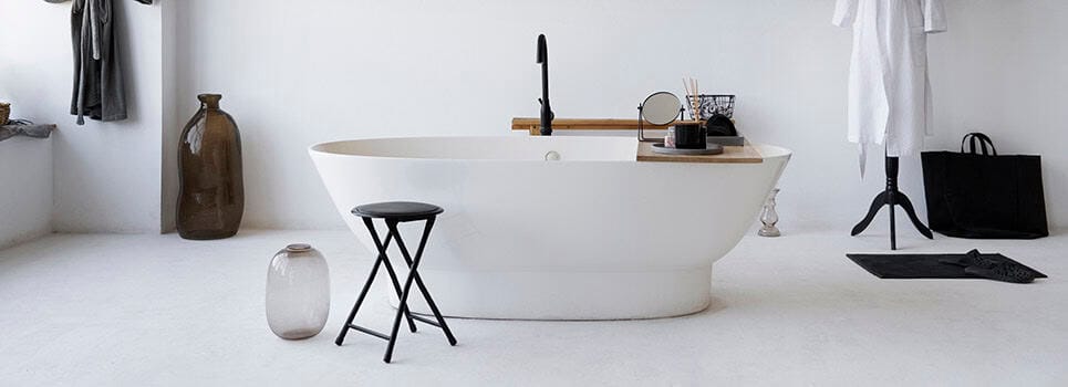 a bathtub with a faucet in a modern bathroom a bathtub with a faucet in a modern bathroom
