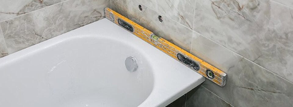 Level the New Tub – checking from side-to-side and front-to-back Level the New Tub - checking from side-to-side and front-to-back