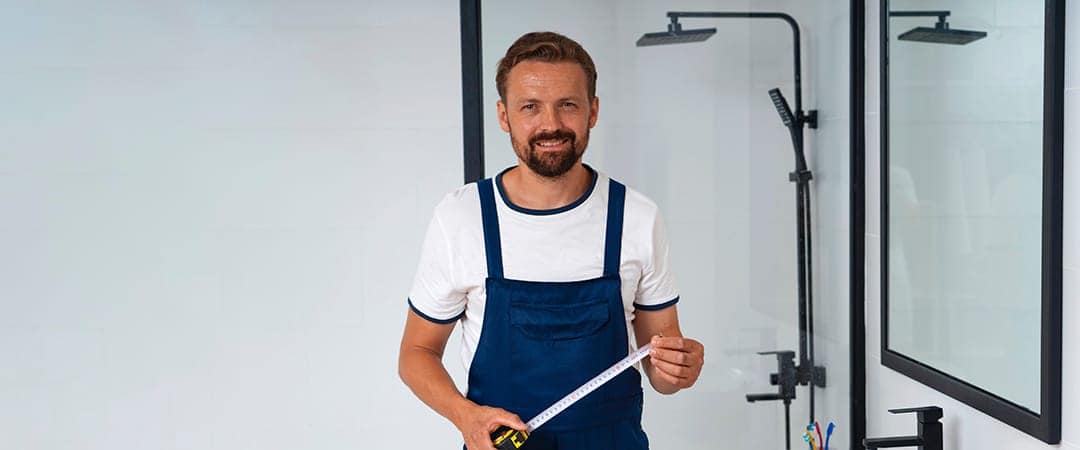 Professional Plumbing doing his installing shower job
