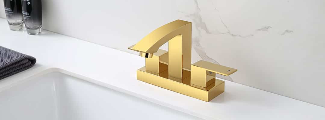 Centerset vs. Widespread Faucets - Gold centerset faucet with dual handle