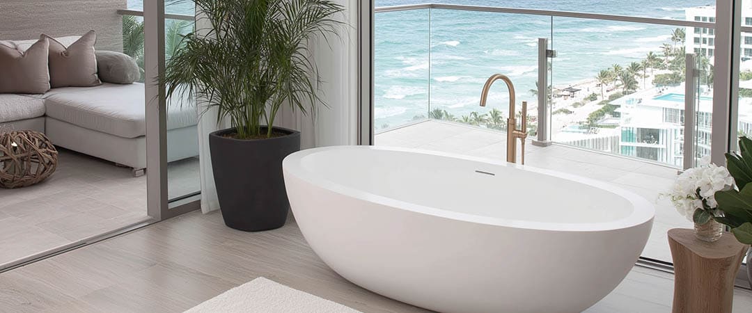 Modern floor-mounted tub faucet in rose gold finish