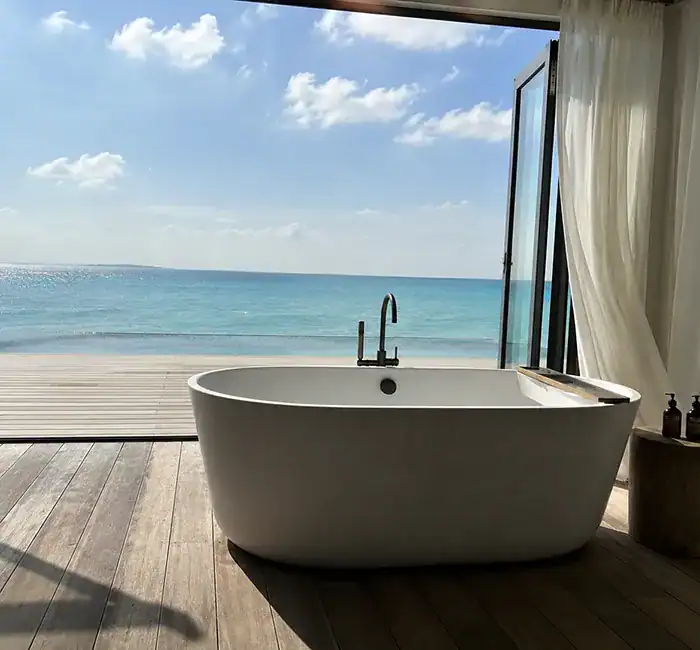Heavy-duty DZR brass shower fixtures installed in a coastal resort helping resist hard water corrosion
