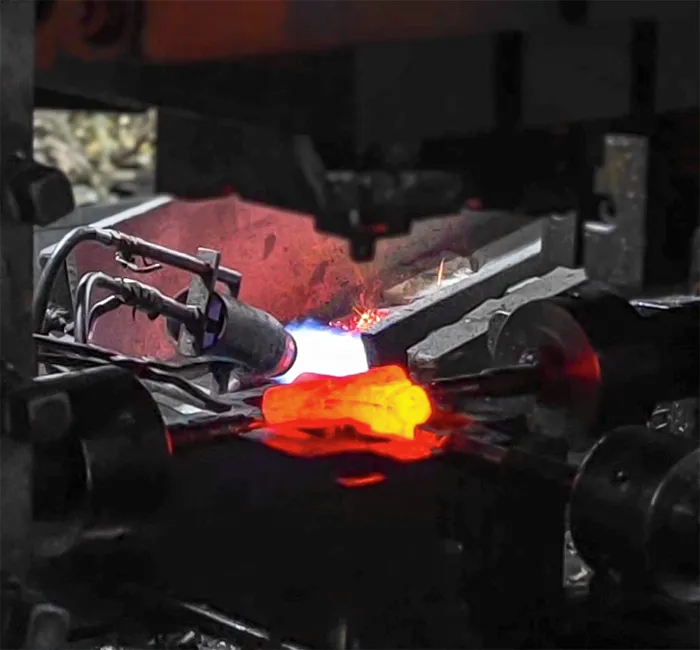 Hot forging a brass faucet body at the Luxuryhome factory in Jiangmen